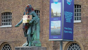Robert Milligan statue with protest placard and cloth before removal in June 2020 © David Parry Museum of London