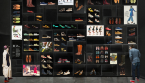 A visualisation of the upcoming exhibition shows a tall series of shelves with a variety of shoes