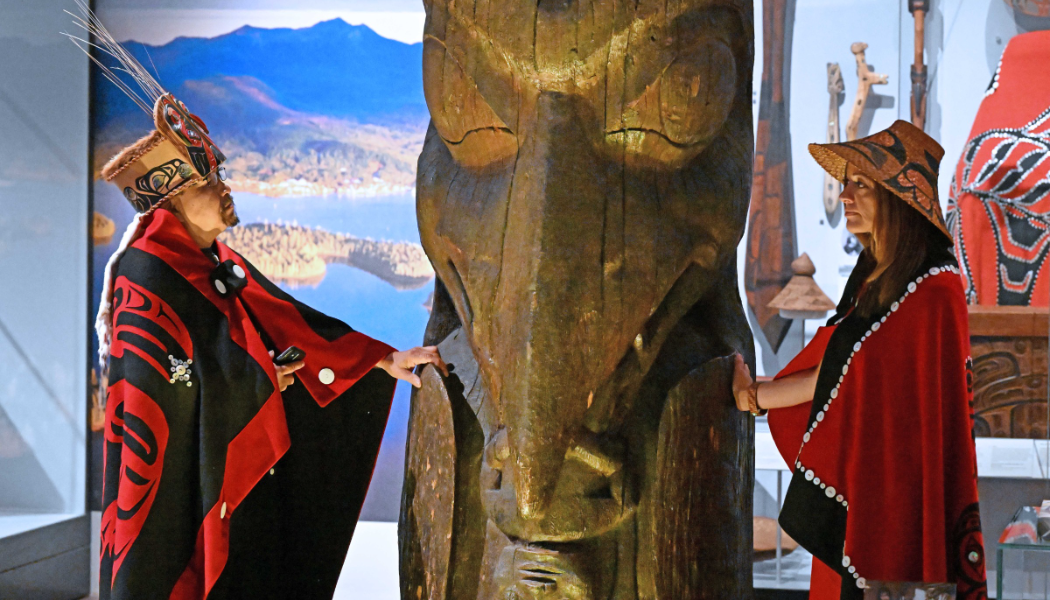 Sim'oogit Ni'isjoohl (Mr Earl Stephens) and Sigidimnak’ Nox Ts'aawit (Dr Amy Parent) of Nisga'a Nation with the memorial pole credit Neil Hanna